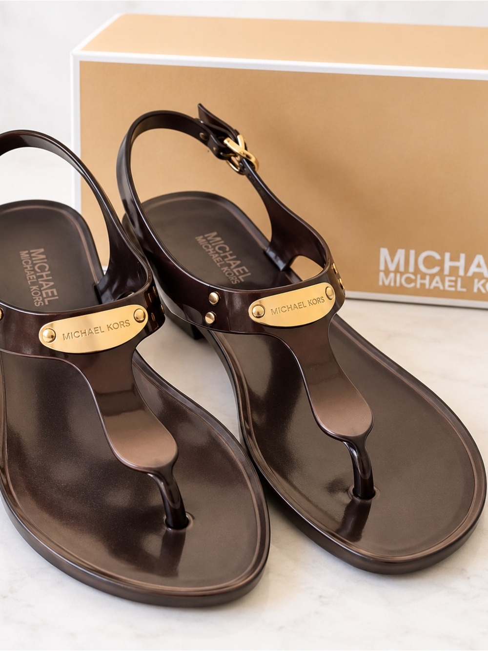 Michael Kors Dark Brown Jelly T-Strap Sandals with Gold Plaque